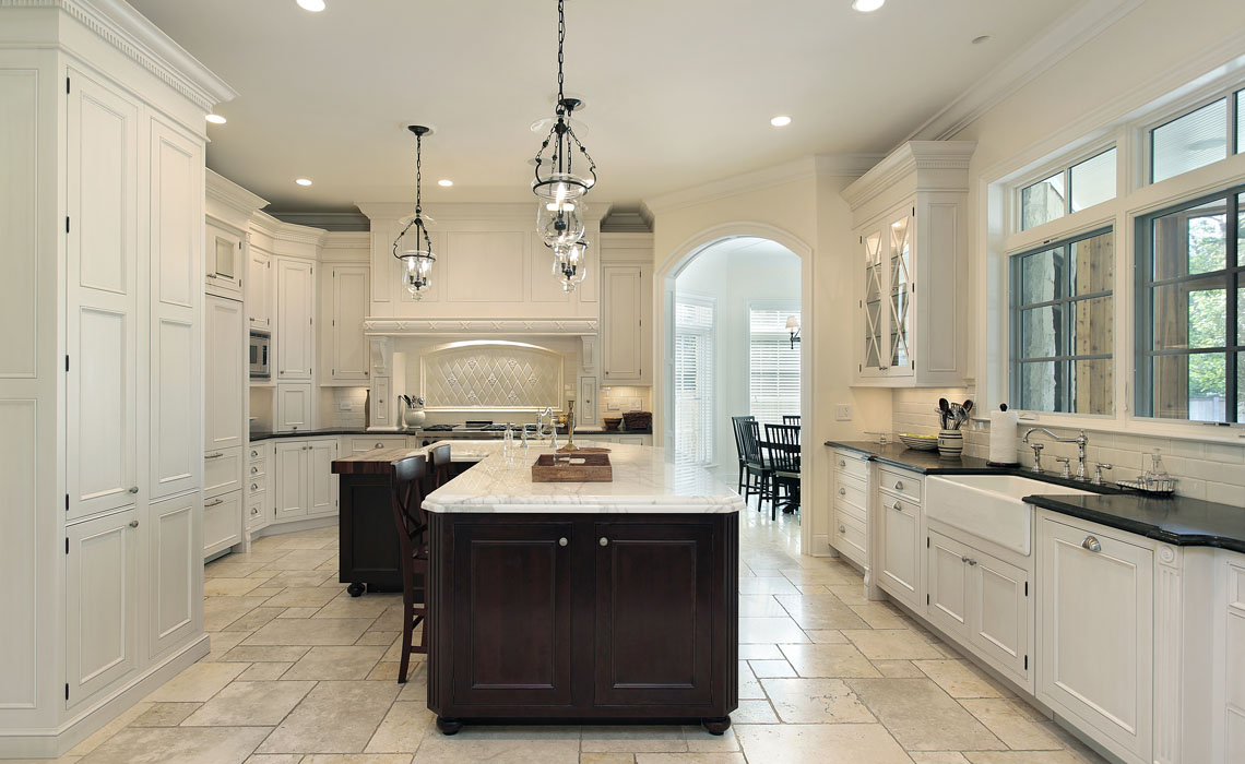 Luxury kitchen in suburban home with white cabinetry